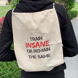 “train insane or remain the same” drawstring bags